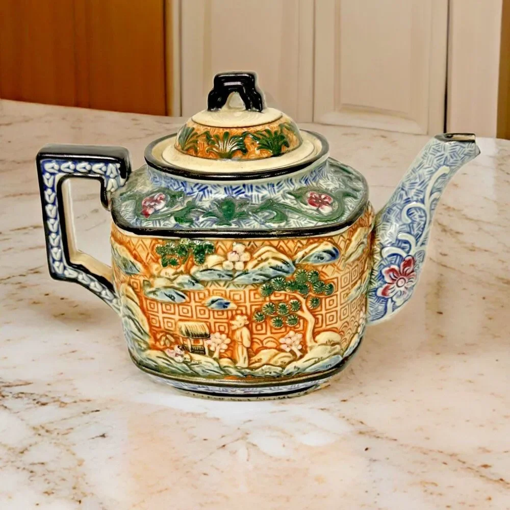 Teapot- vintage ceramic raised Asian  9 inches by 7 Inches